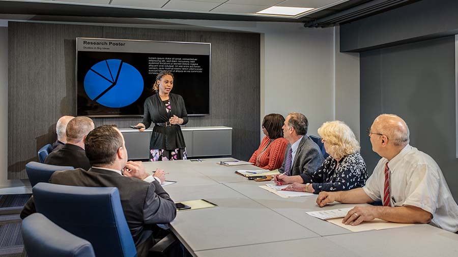 Woman leads a discussion during a meeting in the Pavilion Conference Room